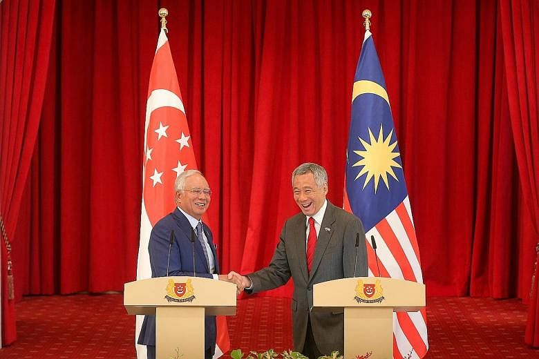 Prime Minister Lee Hsien Loong with his Malaysian counterpart Najib Razak at the Istana, where they held a press conference yesterday after the eighth Singapore-Malaysia Leaders' Retreat.
