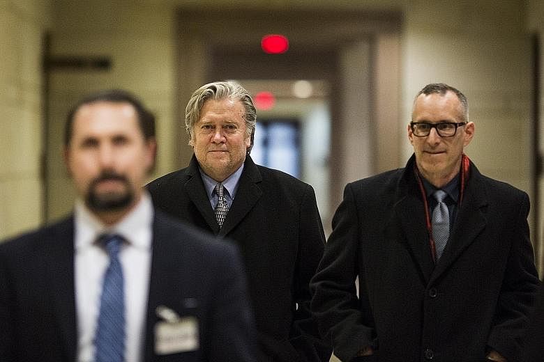 Former White House chief strategist Steve Bannon (centre) leaving Capitol Hill on Tuesday after spending hours in closed-door meetings with members of the House of Representatives Intelligence Committee.
