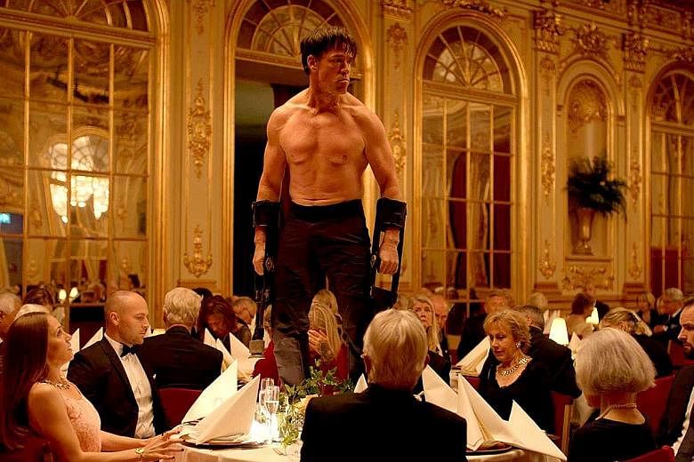 Terry Notary in a jungle predator scene at a formal dinner in The Square.