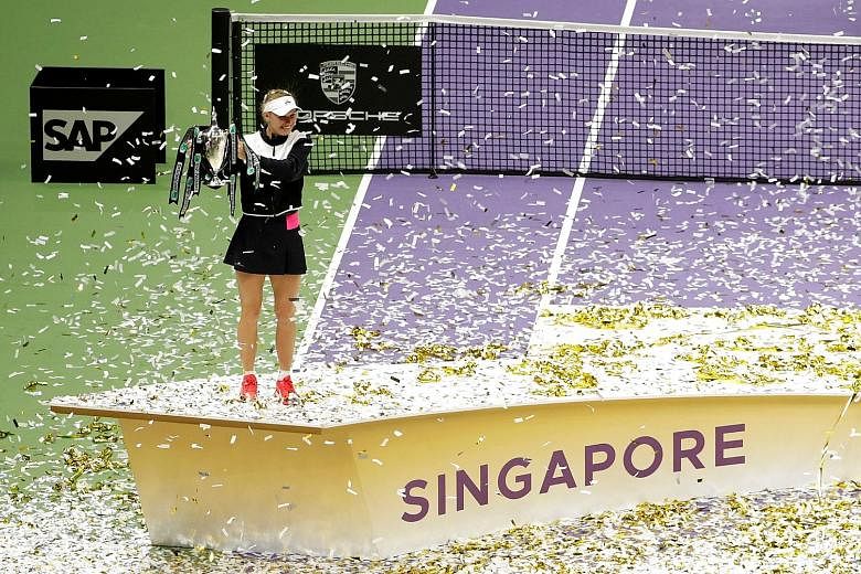 Denmark's Caroline Wozniacki celebrating with the trophy after winning last year's WTA Finals. Singapore has hosted the US$7 million (S$9.3 million) tournament, which features the world's top eight women's singles players and doubles teams, since 201