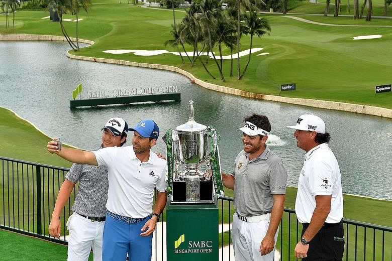 From left: Ryo Ishikawa, Sergio Garcia, Louis Oosthuizen and Pat Perez pose for a wefie with the SMBC Singapore Open trophy at Sentosa Golf Club.