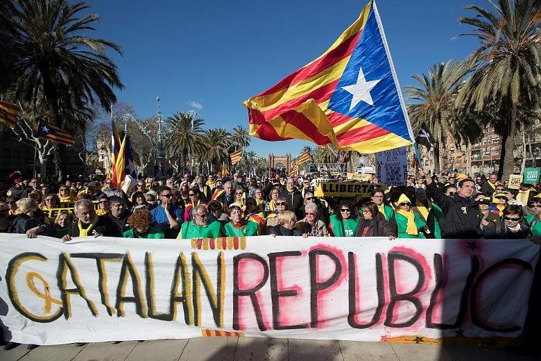 People gathering in Barcelona on Wednesday to watch a session of the new Parliament formed after the Dec 21 regional election that was called by the Spanish Government.