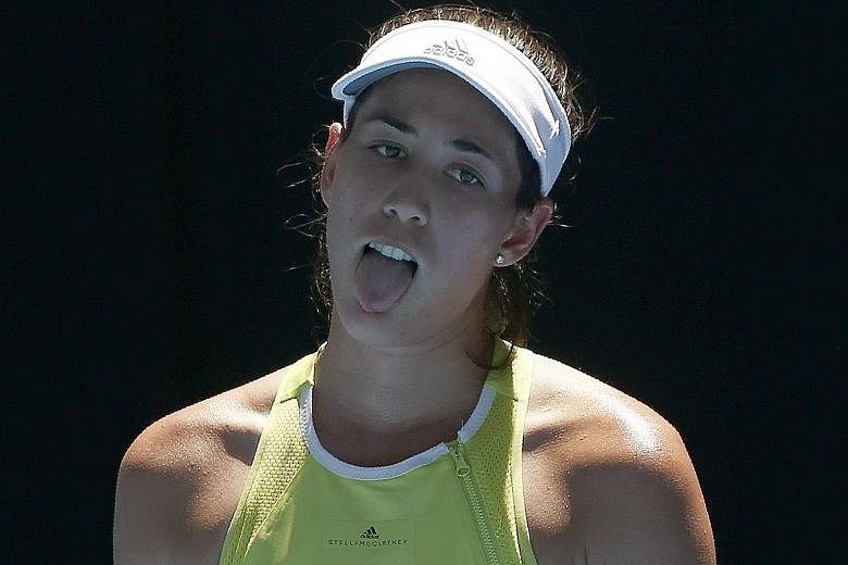 Garbine Muguruza sticking her tongue out in searing conditions at the Rod Laver Arena. The Spanish world No. 3 was also unable to overcome the challenge of Chinese Taipei's Hsieh Su-wei in their second-round match at the Australian Open, becoming the