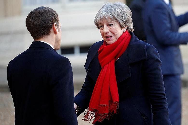 French President Emmanuel Macron with British PM Theresa May in Paris last December. At yesterday's talks in Sandhurst, Mrs May wanted to show that Britain still has plenty to offer France and the European Union.