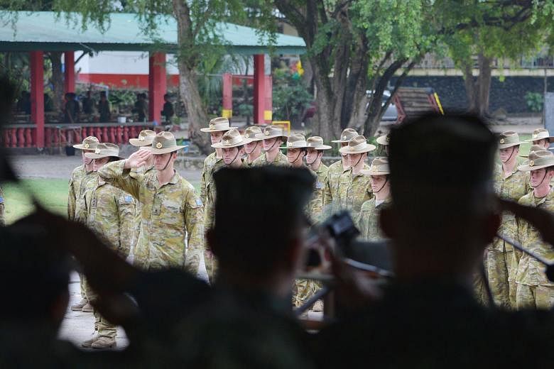 Philippine Marines (foreground) and Australian soldiers at the closing ceremony of their training exercises in the South-east Asian country last month. Canberra's defence engagement with Manila is likely to develop further this year.