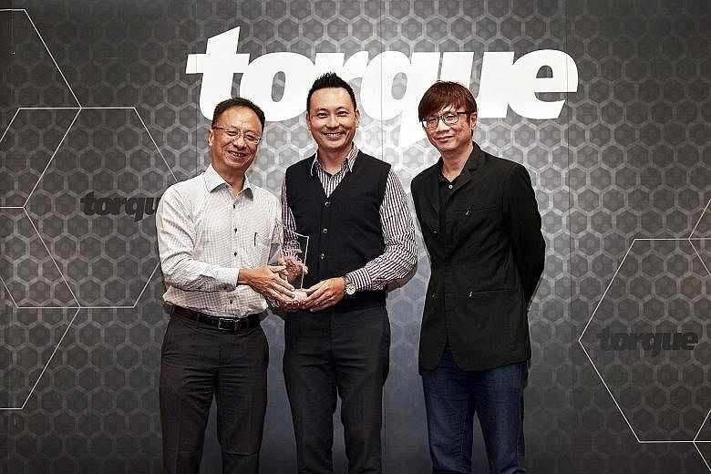 The Straits Times Car of the Year 2017 - Lexus LC500 (From far left) Torque consulting editor Christoper Tan, marketing director of Borneo Motors Samuel Yong and Torque editor David Ting. Best Family Saloon - Renault Megane Sedan Best Seven-seater SU