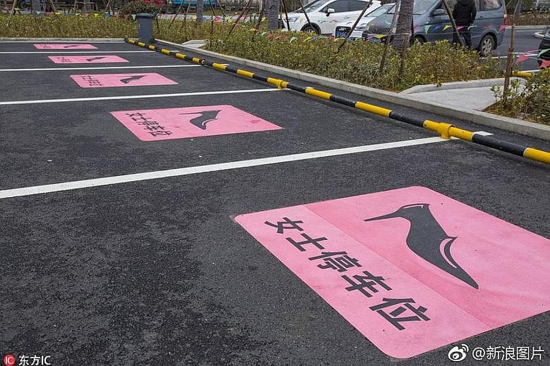 Oversized parking spaces marked with a stiletto on a pink background in Zhejiang province have stirred debate in China, with some saying that they reinforce the stereotype of women being bad drivers.
