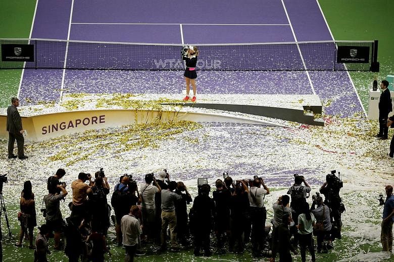 Denmark's Caroline Wozniacki celebrating with the trophy after winning last year's WTA Finals, which will be played here for the last time in October. SportSG began Tennis Week at last year's edition, which included fringe events and community engage