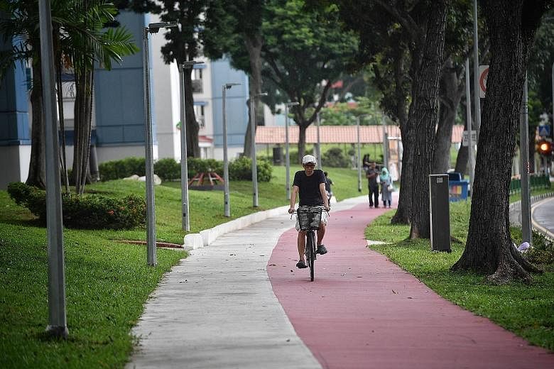 Designated bike lanes, like this one near Heartbeat@ Bedok, are painted red to distinguish them from regular footpaths, making Bedok the second town with such red lanes after Ang Mo Kio.