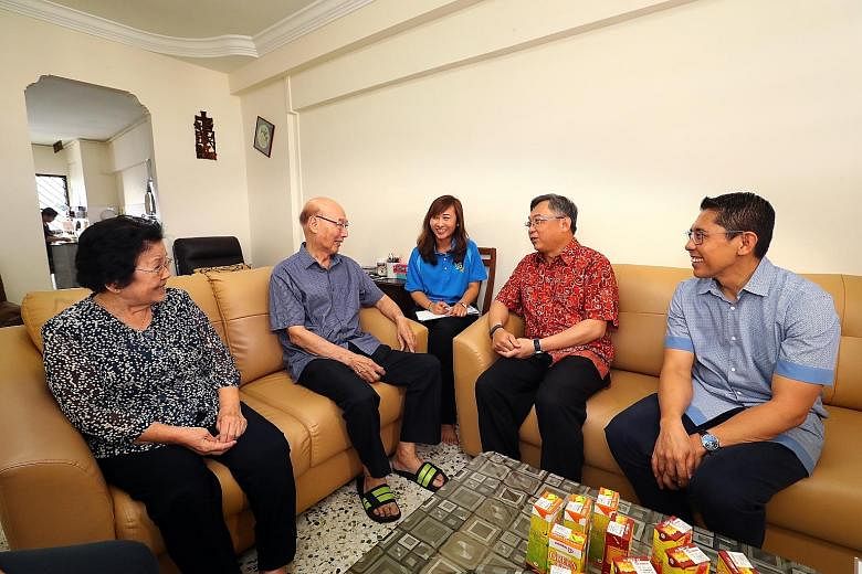 (From left) Madam Tan Siew Hong and her husband, Mr Low Kok Tee, who both have diabetes and are involved in the Health Peers Programme, chatting with CGH senior executive of strategic planning and development Valencia Lim, Health Minister Gan Kim Yon