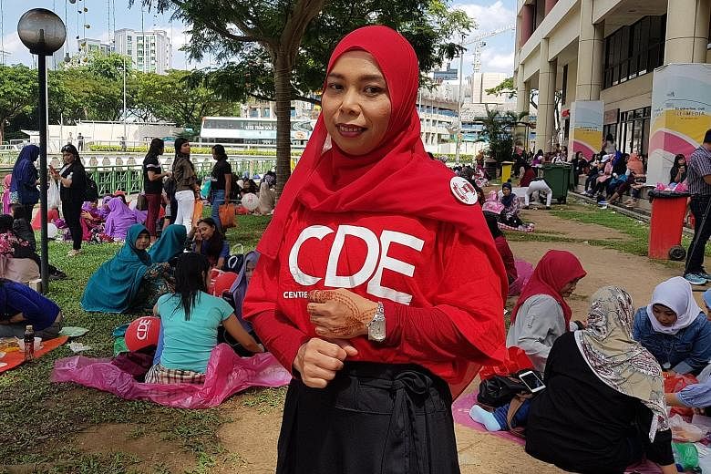 Indonesian domestic worker Rusmawati at the Centre for Domestic Employees' second anniversary celebration at City Plaza yesterday. The centre has made information on maids' rights more accessible, she said.