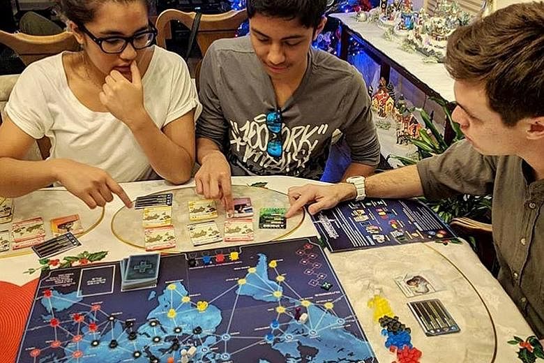 A trendy board game to play is Pandemic, in which one's mission is to treat diseases and find cures.
