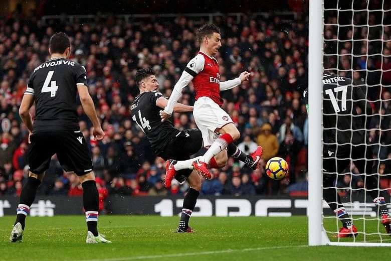Arsenal centre-back Laurent Koscielny bundling home their third goal in a 4-1 thrashing of Crystal Palace at home on Saturday. The contest was effectively over after four goals in the first 22 minutes as the Gunners prepare for the imminent signing o