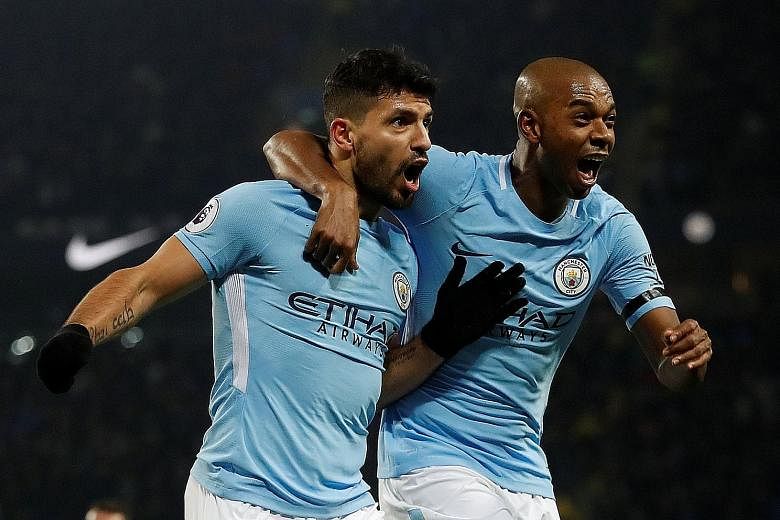Sergio Aguero, celebrating with Fernandinho after completing his treble, has scored the EPL's first perfect hat-trick (header, left foot, right foot) since he netted one against Newcastle in October 2015.