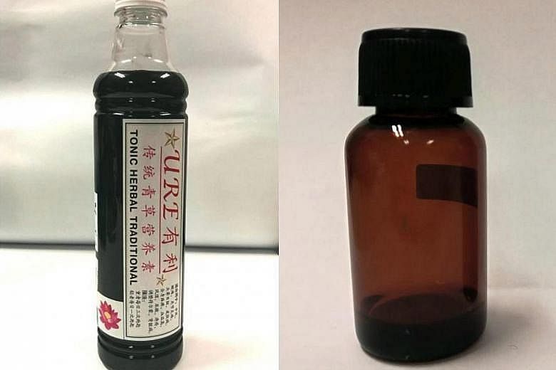The two are URE Tonic Herbal Traditional (far left), sold by a traditional practitioner in Malaysia; and a facial solution bought online and sold in unlabelled bottles by a beautician.