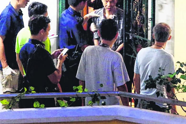 Mr Kong Peng Yee being led away by police officers in March 2016. He has spent the past three months at the IMH as a voluntary patient after serving a two-year jail term for killing his wife of 36 years while having delusions that his family was tryi