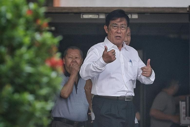 Veteran athletics coach Loh Siang Piow, who is accused of using criminal force and molesting the teen, outside the State Courts yesterday.