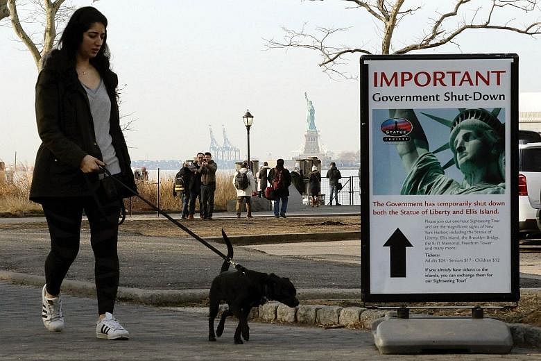 A notice at the Liberty State ferry terminal at New York's Battery Park on Sunday announcing the closure of the Statue of Liberty as part of the US government shutdown.