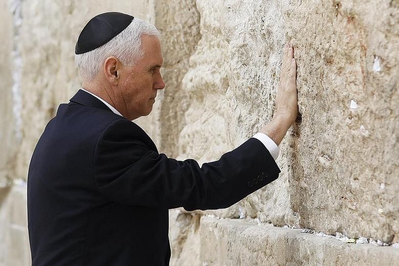 US Vice-President Mike Pence touching the Western Wall, Judaism's holiest prayer site, in Jerusalem's Old City yesterday.