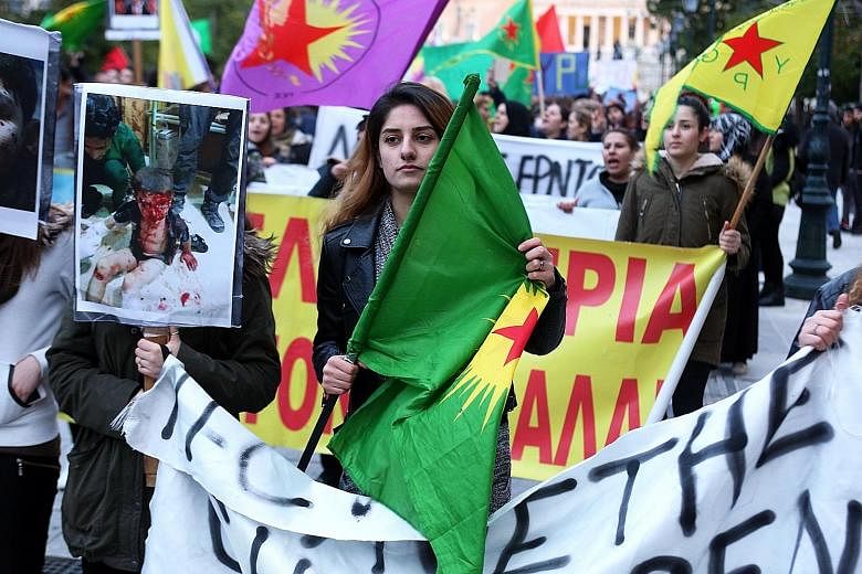 Kurds in Athens protesting on Tuesday against the Turkish offensive in Afrin, in north-western Syria, and the attack on US-backed Syrian Democratic Forces. The Turkish military said on Tuesday that it had killed at least 260 Syrian Kurdish fighters a