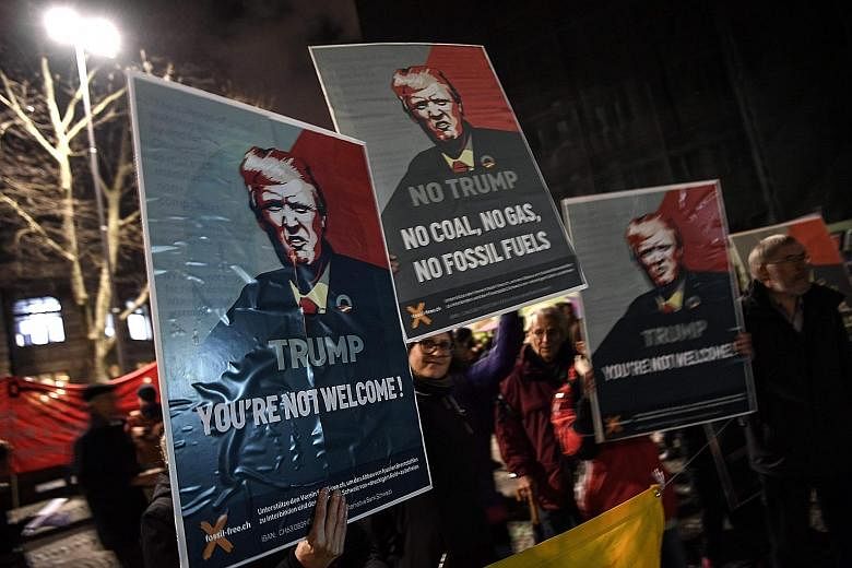 Activists protesting in Zurich on Tuesday against the attendance of US President Donald Trump at the World Economic Forum in Davos, Switzerland.