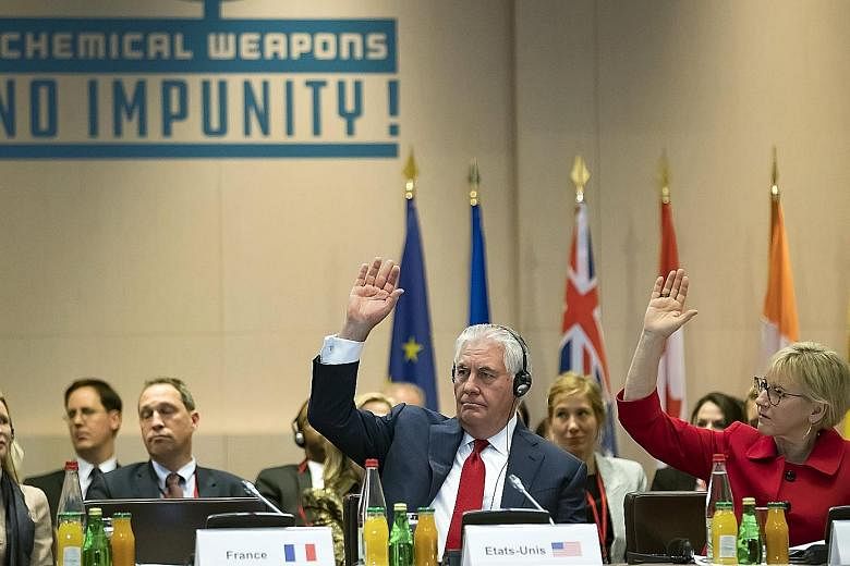 US Secretary of State Rex Tillerson and Swedish Foreign Minister Margot Wallstrom acknowledge resolutions during a meeting on the international partnership against impunity for the use of chemical weapons.