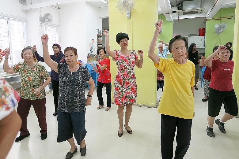 Ms Indranee Rajah (second from right) dancing with some seniors at the Awwa Dementia Day Care Centre yesterday.