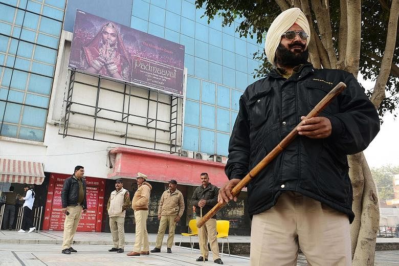 Policemen in Amritsar, Punjab, standing guard yesterday outside the Suraj Chand Tara cinema hall, which is scheduled to screen Padmaavat.