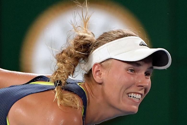 Tennis: Caroline Wozniacki Beats Simona Halep To Capture First Major At ...