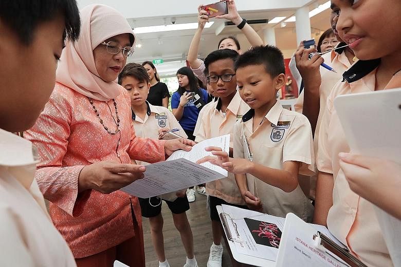President Halimah Yacob meeting Loyang Primary School pupils, who are among 228 students from primary and secondary schools taking part in the first Istana Heritage Gallery Challenge. Participants have to answer quizzes about the heritage and 