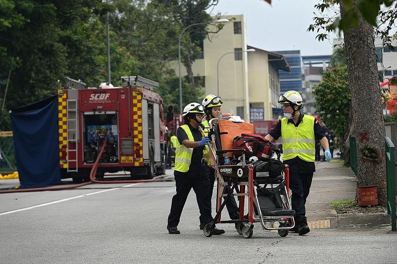 SCDF personnel at the scene of the ammonia gas leak in a building in Fishery Port Road. About 100 workers had to be evacuated from the premises.