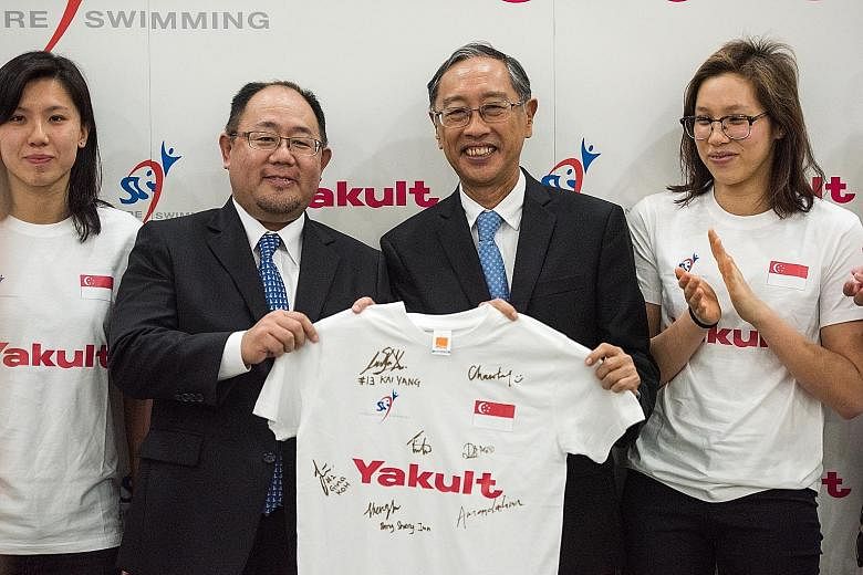 Yakult Singapore managing director Kiyotaka Sakurai (left) with Singapore Swimming Association (SSA) president Lee Kok Choy