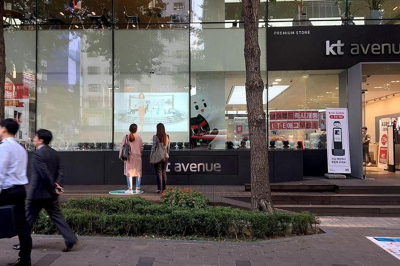 Machine-human promotional interactions, such as KT Corporation's interactive signage, appeal to millennials and digital natives.