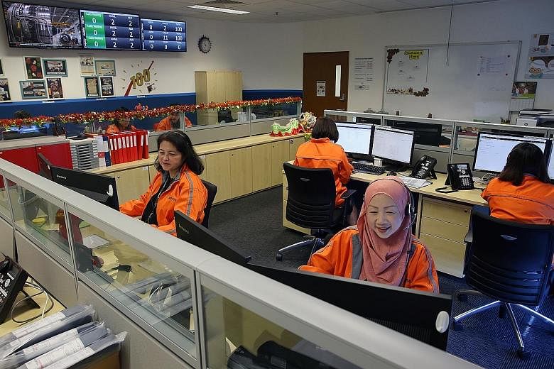 Staff at Care Line, a 24/7 helpline run by Changi General Hospital, which seniors can call if they need help such as medical attention. It was launched in the eastern region in November 2016 and was expanded to cover Tanjong Pagar and Radin Mas this 