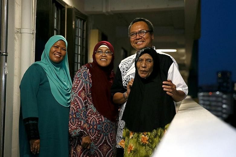 Left: Mr Mohamed Nassir Ismail with his nieces (from left) Sarah Hamid and Sarinah Hamid, and cousin Maimunah Ahmad. More than 50 of his relatives live in the same HDB blocks in Upper Boon Keng Road. Right: History teacher Mohamed Shahrom Mohamed Tah
