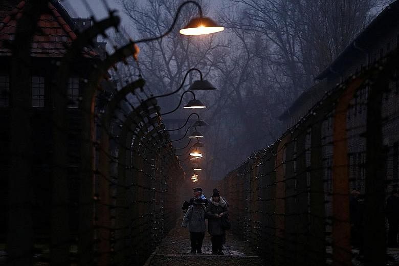 Survivors and guests at the former Nazi death camp of Auschwitz. A diplomatic row between Poland and Israel brewed over a new Bill passed by Poland as the world marked International Holocaust Remembrance Day on Saturday.