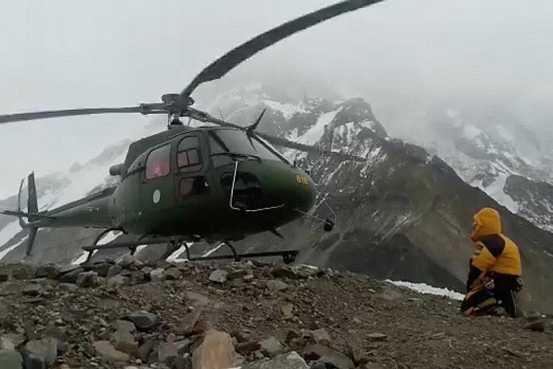A Pakistani military helicopter sets off in an attempt to rescue the two stranded climbers, although attempts to save the second mountaineer were later called off because of the extreme danger posed to rescuers by the altitude and weather.