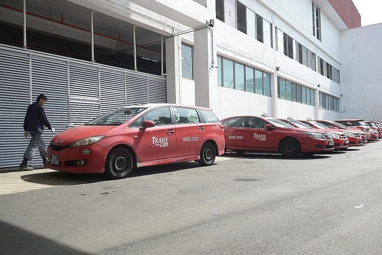 The last of Trans-Cab's CNG taxis to be taken off the road parked at the company's premises in Ang Mo Kio.