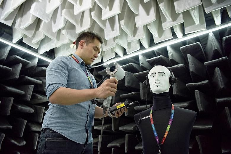 Acoustics and vibration engineer Nicklaus Yu in the acoustic chamber at Dyson Singapore. As acoustic team leader, Mr Yu not only tackles technical issues, but also considers business operations, in addition to managing a team.
