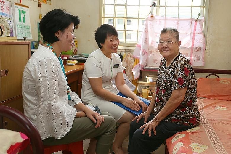 Madam Tan Sok Ngo, 78, was not readmitted to hospital after she was cared for under the Esther Network Singapore scheme. She is seen here with Ms Seng Gek Siang (centre), patient navigator, Singapore General Hospital, and Ms Audrey Leo, care manager,