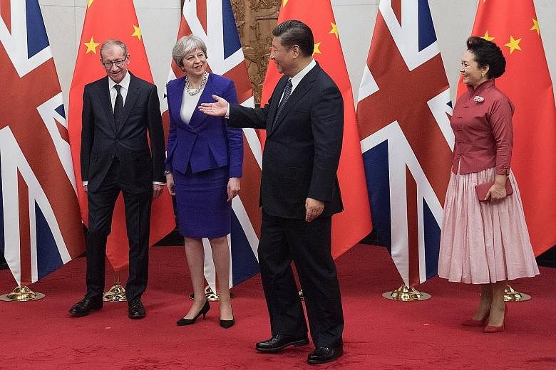 British Prime Minister Theresa May, with her husband Philip May, Chinese President Xi Jinping and his wife Peng Liyuan at Diaoyutai State Guest House. The leaders agreed to hold a joint trade and investment review as the first step in delivering an a