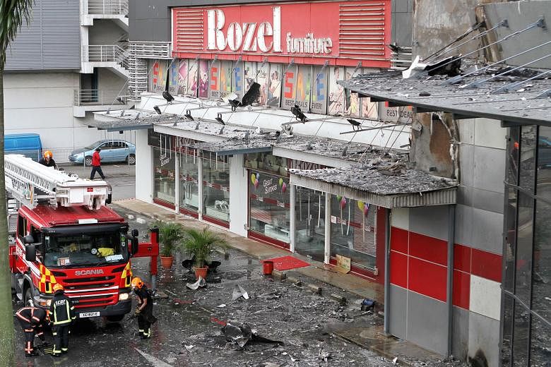 Firefighters evacuated about 50 people from the Cambridge Industrial Trust building at 30, Toh Guan Road, after a fire broke out in the building in May last year. The fire reportedly spread across multiple floors via the building's external cladding,