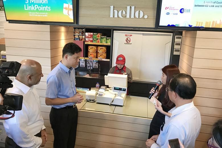 NTUC secretary-general Chan Chun Sing at the launch of the partnership between EZ-Link and NTUC Link at the Cheers convenience store at Tampines MRT station yesterday. In the second quarter of this year, Cheers customers can top up their ez-link card