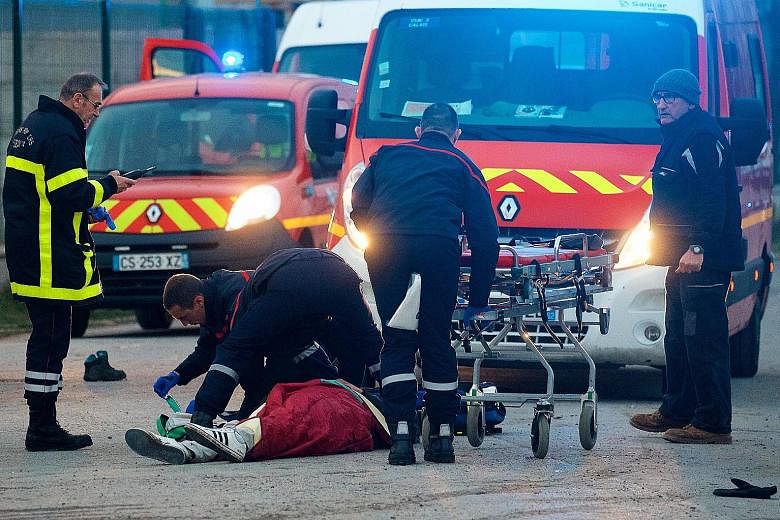A migrant receiving medical assistance following clashes near Calais on Thursday. Police had attempted to stop what was described as an unprecedented level of violence, the French authorities confirmed, as Afghan and African migrants fought with iron