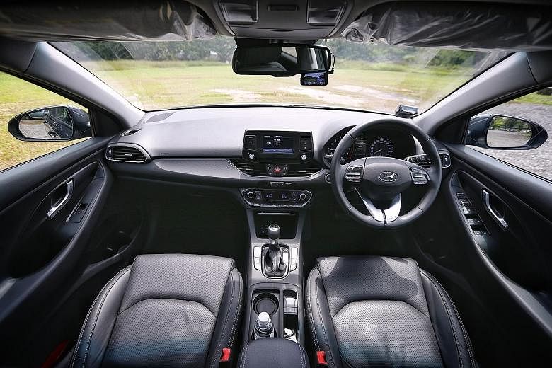 The Hyundai i30 hatchback has a multi-function steering wheel, and an electric parking brake with auto hold and release.