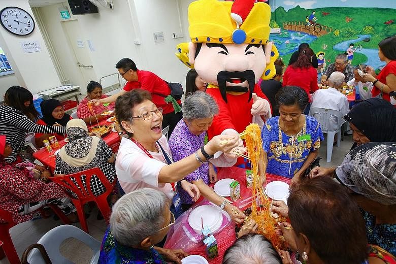 More than 20 staff from Singapore Press Holdings (SPH) distributed festive goodie bags to 170 senior citizens at Lions Befrienders (Ang Mo Kio) Senior Activity Centre yesterday. As part of the SPH Staff Volunteers Club's annual "SPH Cares with Bags o