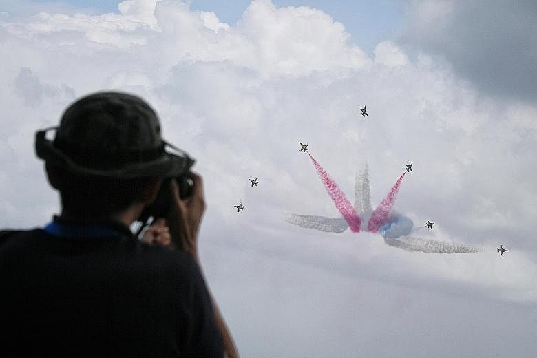 South Korea's Black Eagles performing at a preview of the Singapore Airshow yesterday. The airshow, which kicks off tomorrow, is expected to draw more than 130,000 visitors.