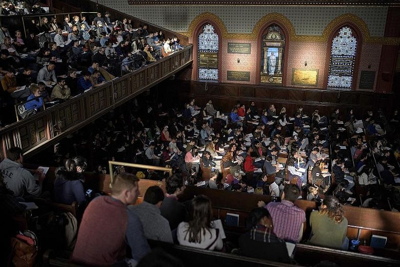 Students filling up the seats in Battell Chapel for Professor Laurie Santos' Psychology and the Good Life class at Yale University last month. The course, with nearly 1,200 students signed up, tries to teach them how to lead a happier, more satisfyin