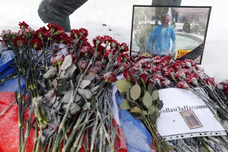 Body Of 'hero' Russian Pilot Killed In Syria Brought Home | The Straits ...