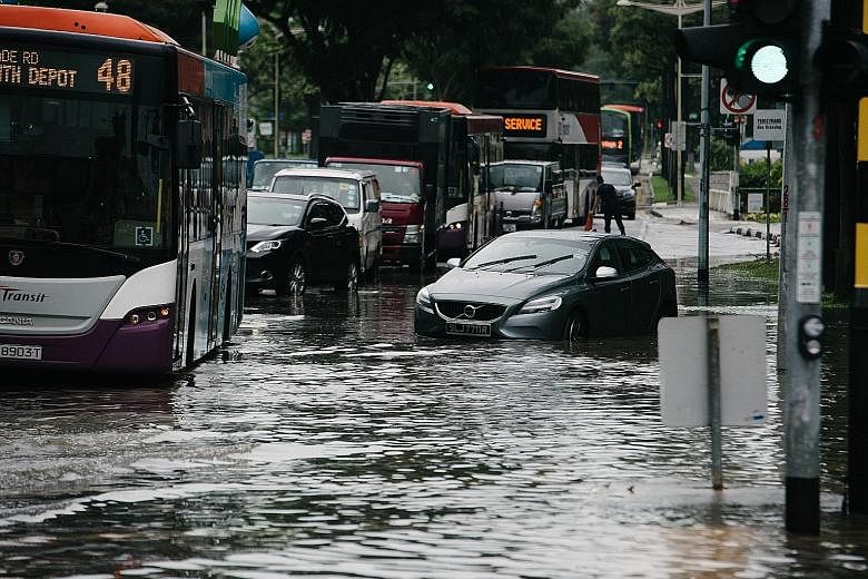 The scene at the junction of Upper Changi Road and Bedok North Avenue 4 on Jan 8. With climate change, Singapore can expect intense rainfall to be the norm in future, said Minister for the Environment and Water Resources Masagos Zulkifli. He said dra